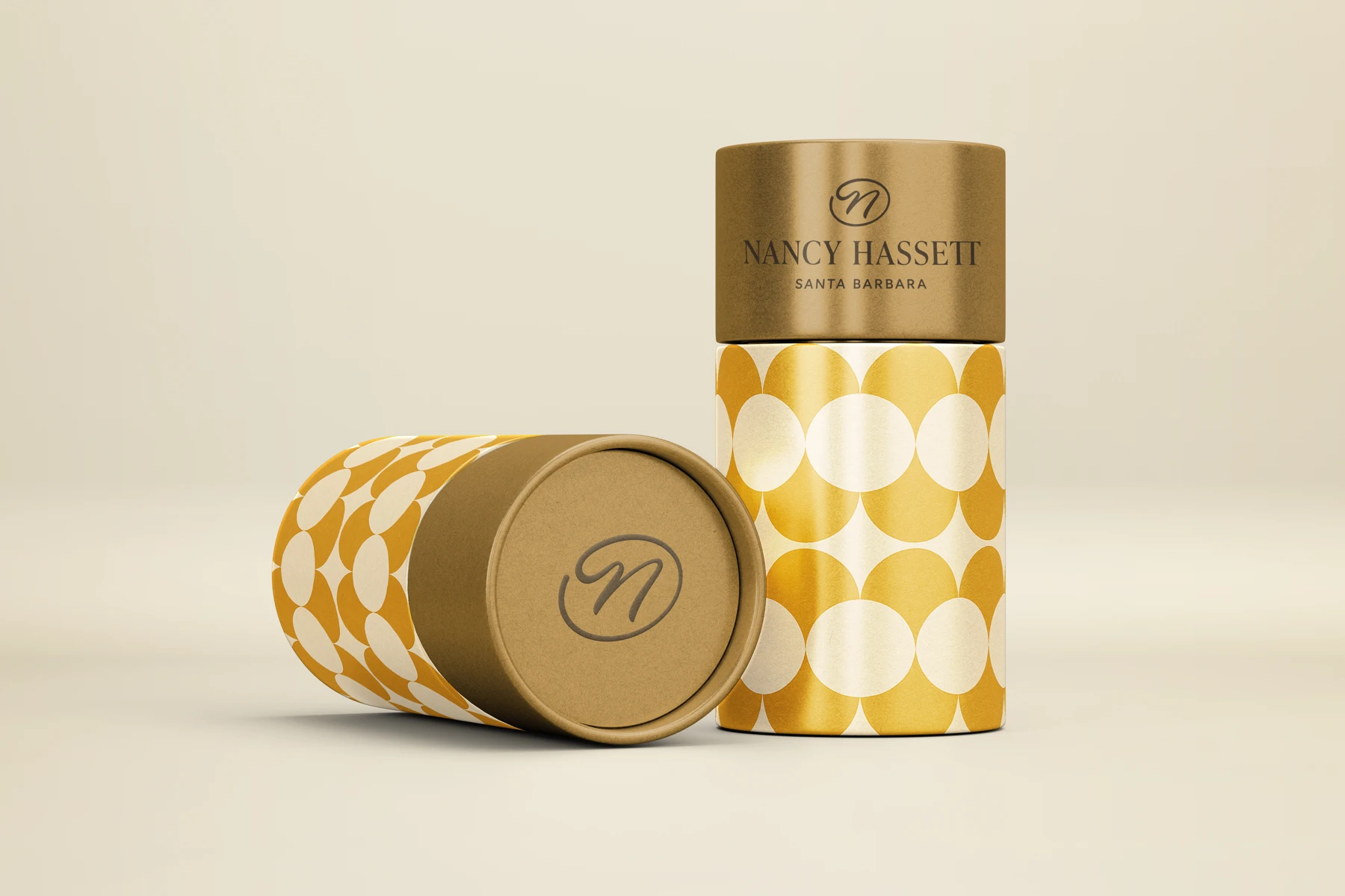Original gold-lidded Nancy Hassett cylinders with a geometric circle pattern